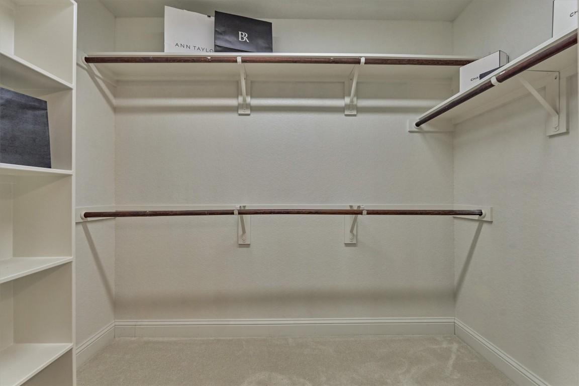 6 Windsor Bridge Drive Conroe, TX 77384 - Photo 21 of 46 The spacious walk in primary closet.