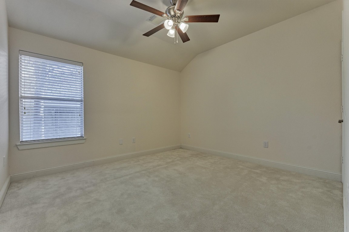 6 Windsor Bridge Drive Conroe, TX 77384 - Photo 27 of 46 The secondary bedroom in the home.