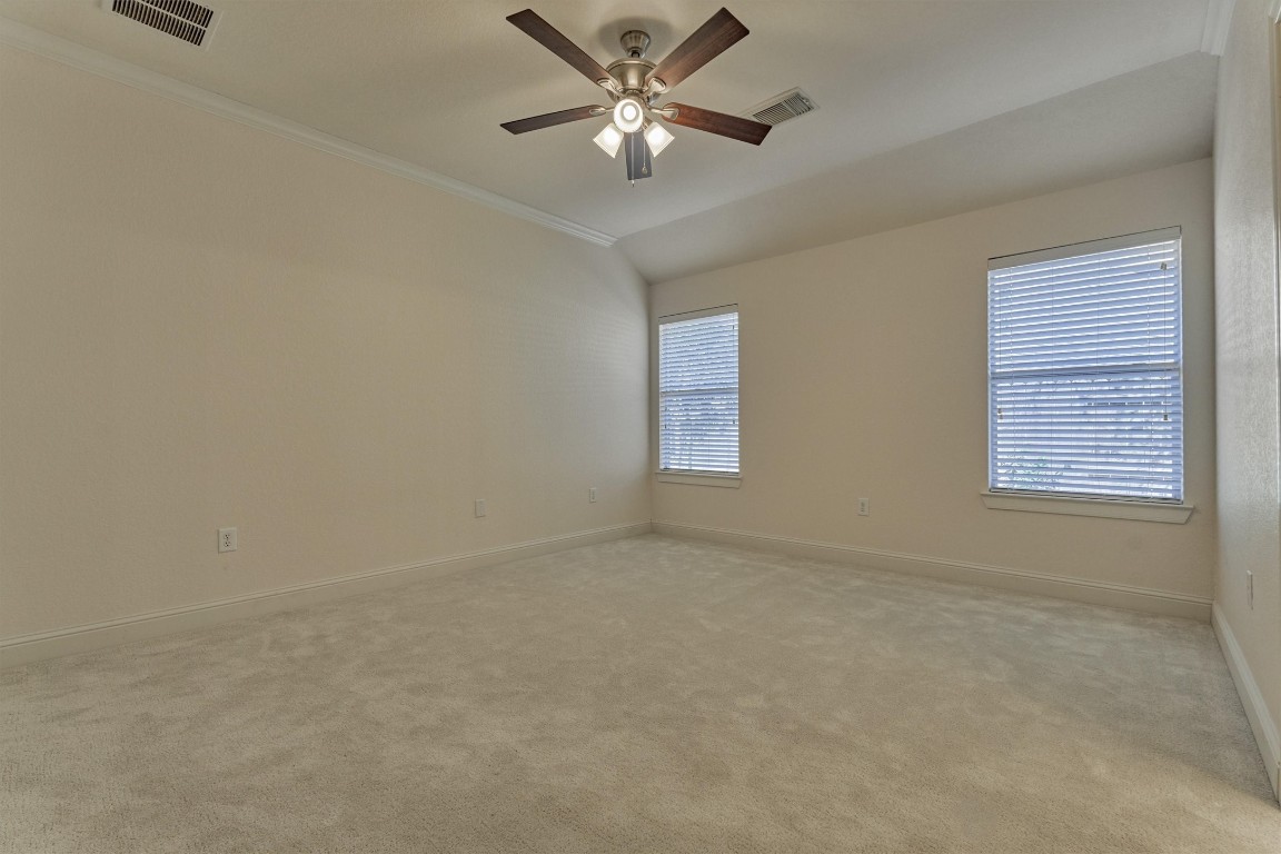 6 Windsor Bridge Drive Conroe, TX 77384 - Photo 28 of 46 The primary en-suite bedroom is very spacious and tucked away for privacy.