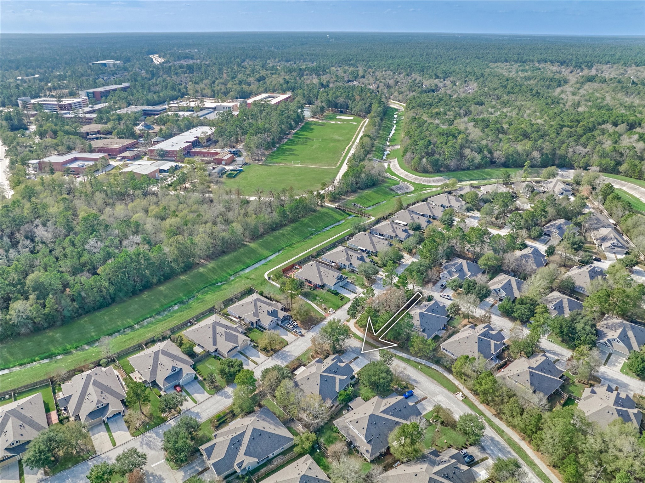 6 Windsor Bridge Drive Conroe, TX 77384 - Photo 40 of 46 an aerial view of a city with lots of residential buildings