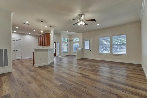 a view of a kitchen with an empty space and a window