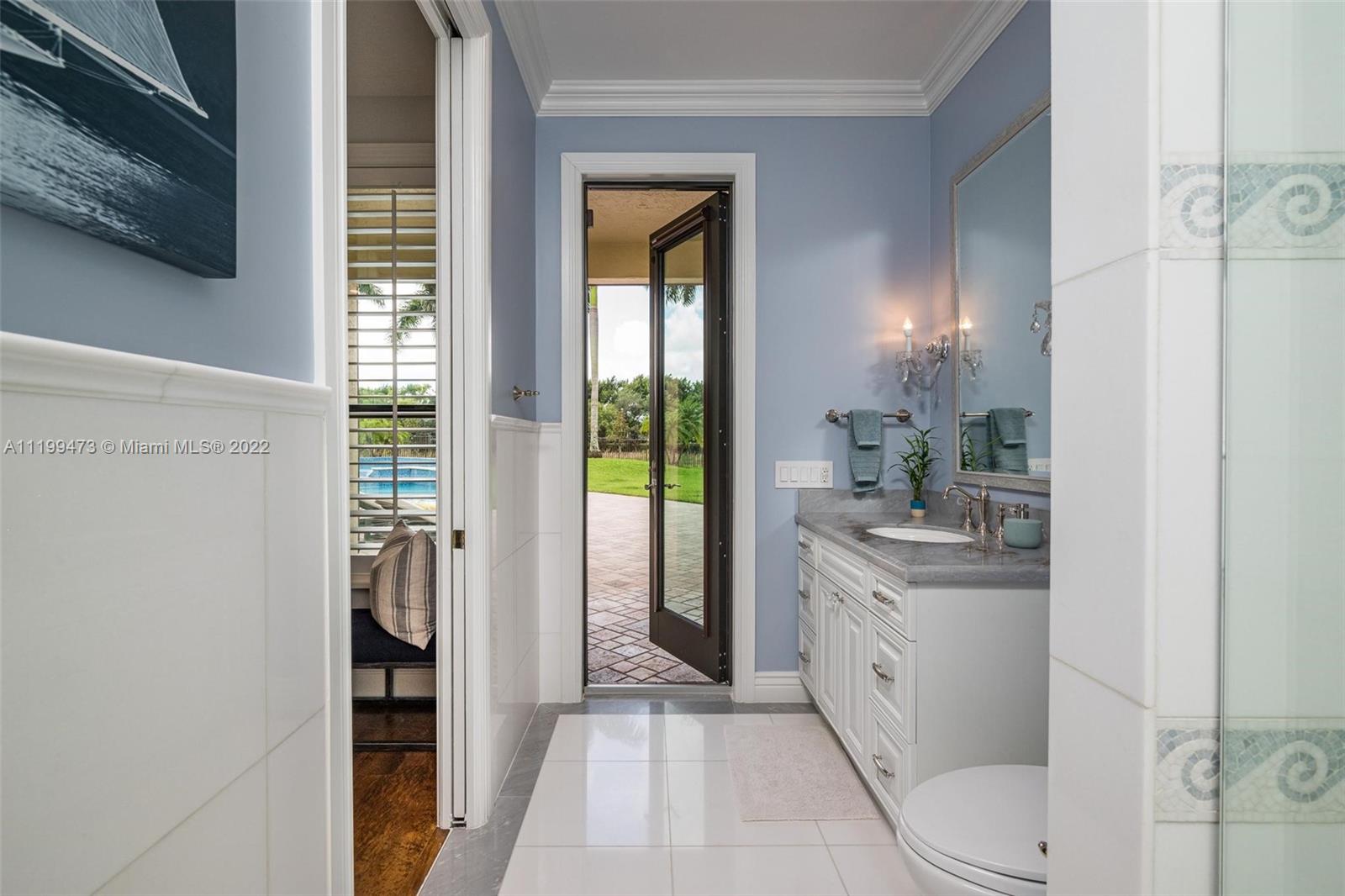 3510 Windmill Ranch Road Weston, FL 33331 - Photo 22 of 59 a bathroom with a sink a toilet and shower