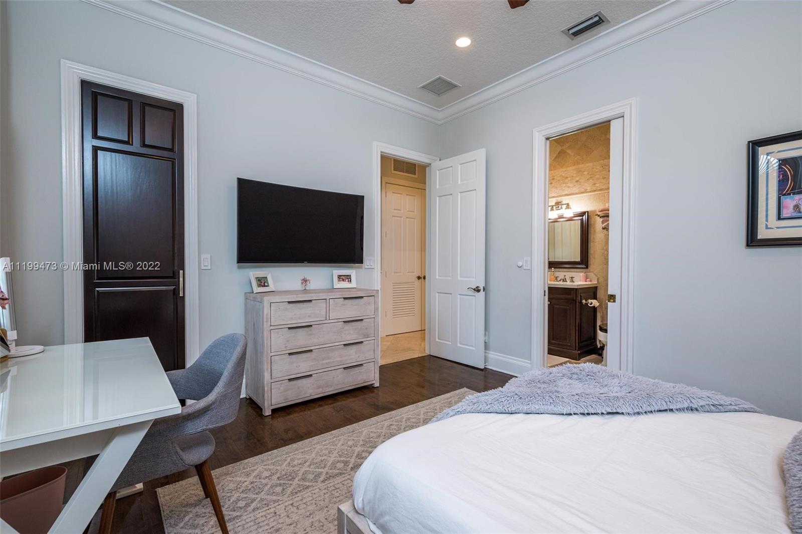 3510 Windmill Ranch Road Weston, FL 33331 - Photo 28 of 59 a bedroom with a bed and a flat screen tv in it