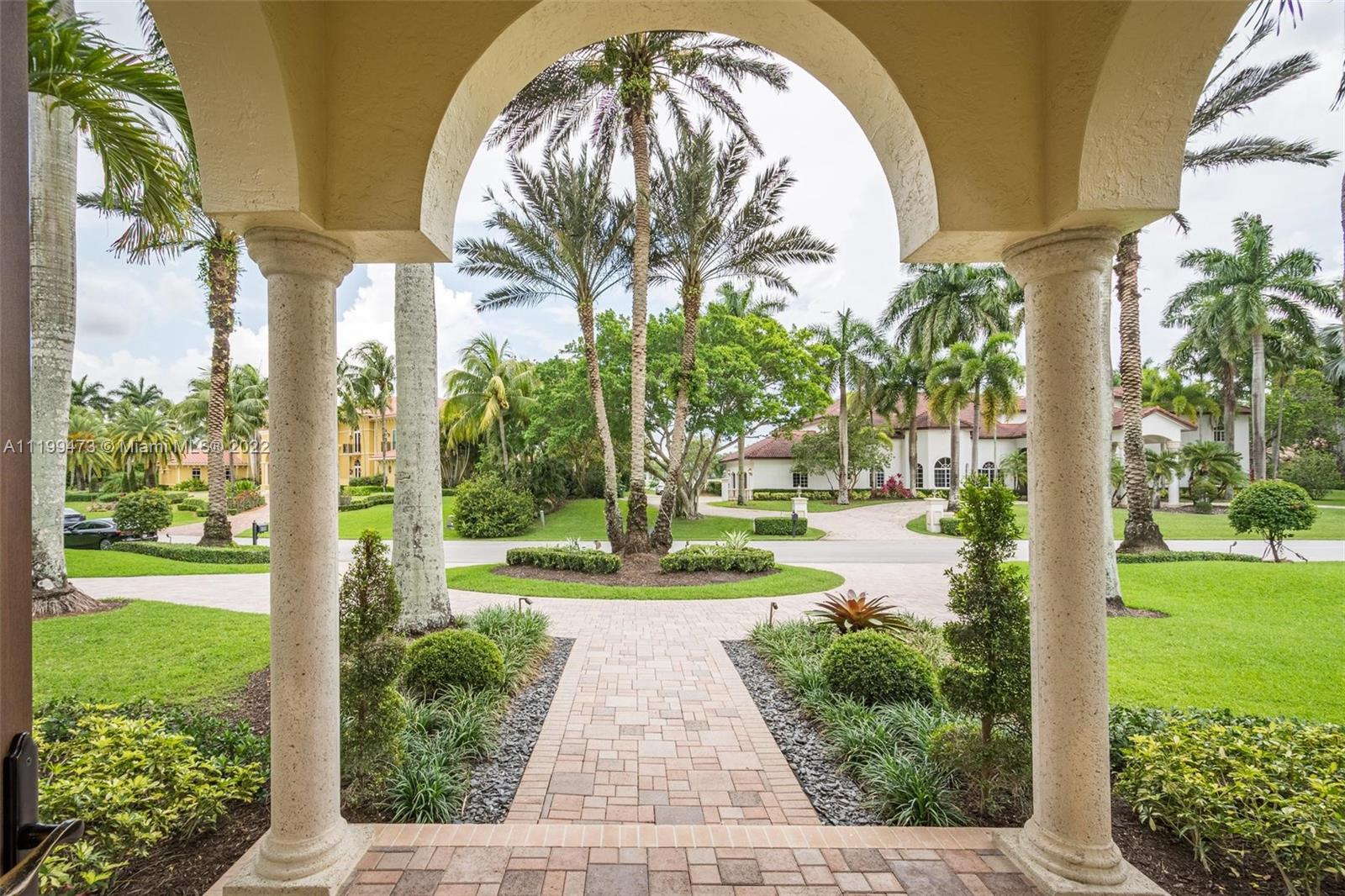 3510 Windmill Ranch Road Weston, FL 33331 - Photo 4 of 59 a view of a yard with plants and large trees