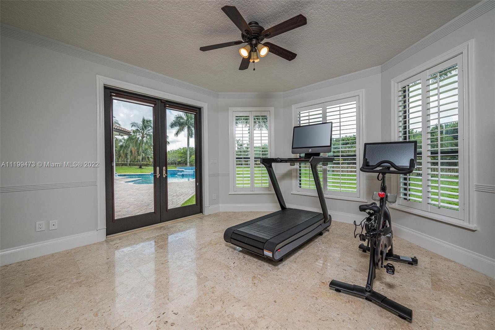 3510 Windmill Ranch Road Weston, FL 33331 - Photo 45 of 59 a view of a room with gym equipment