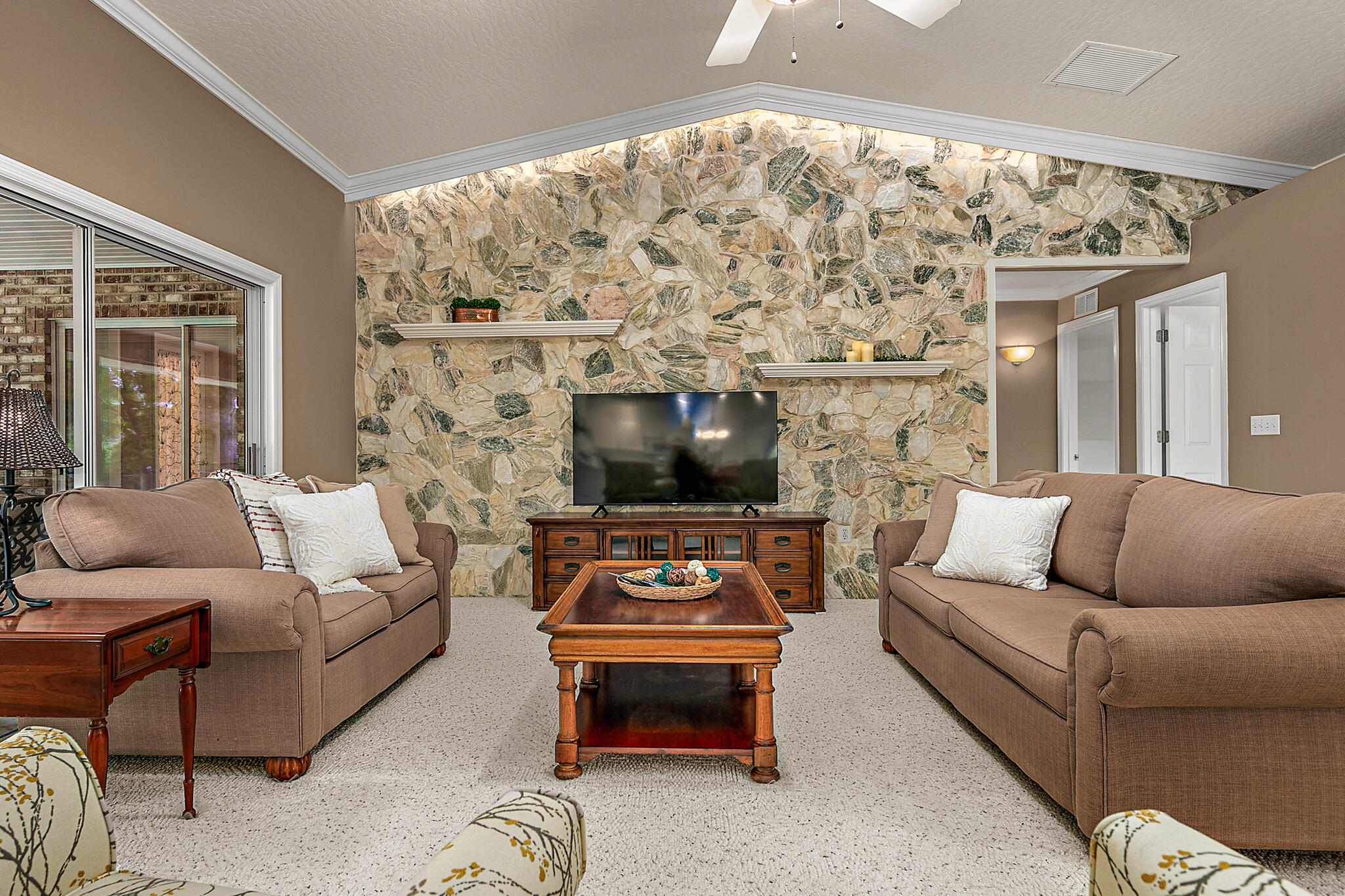 3240 Weber Road Malabar, FL 32950 - Photo 18 of 47 a living room with furniture and a flat screen tv