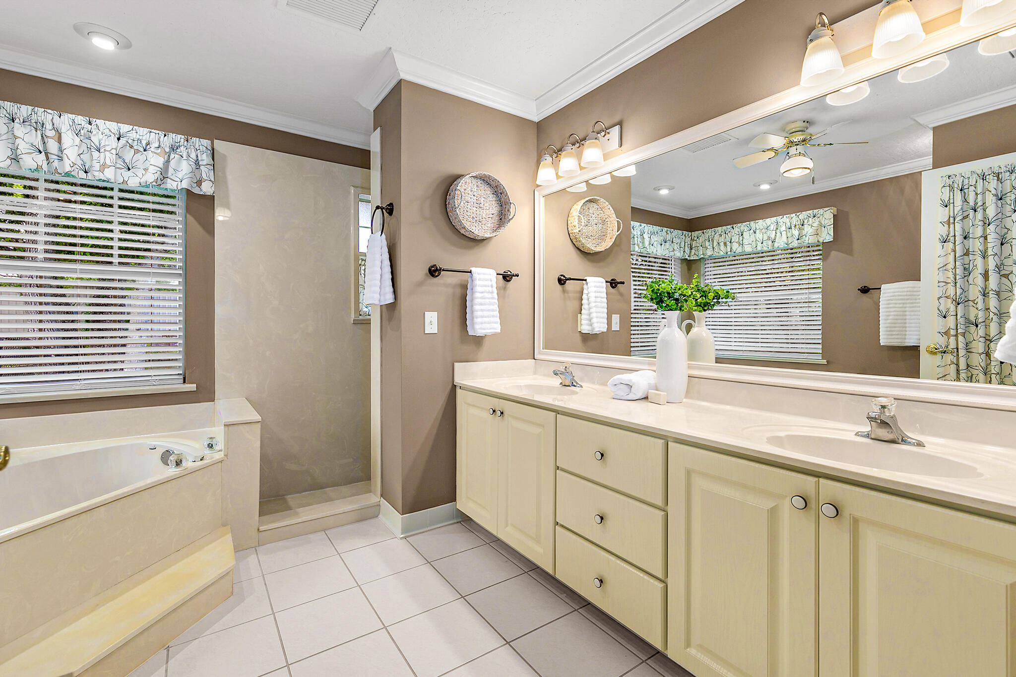 3240 Weber Road Malabar, FL 32950 - Photo 27 of 47 a spacious bathroom with a granite countertop sink mirror and a bathtub