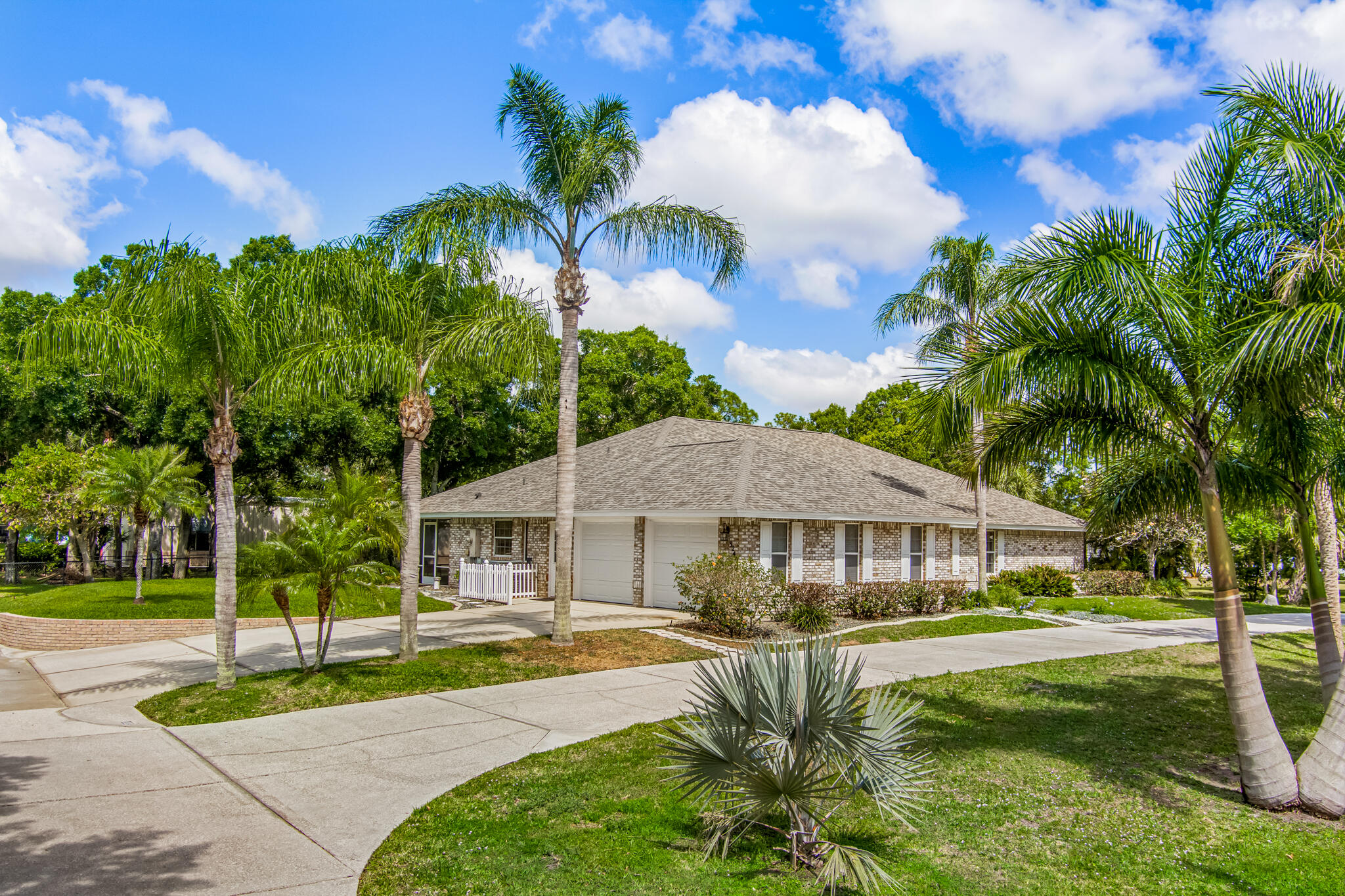 3240 Weber Road Malabar, FL 32950 - Photo 3 of 47 a front view of a house with garden