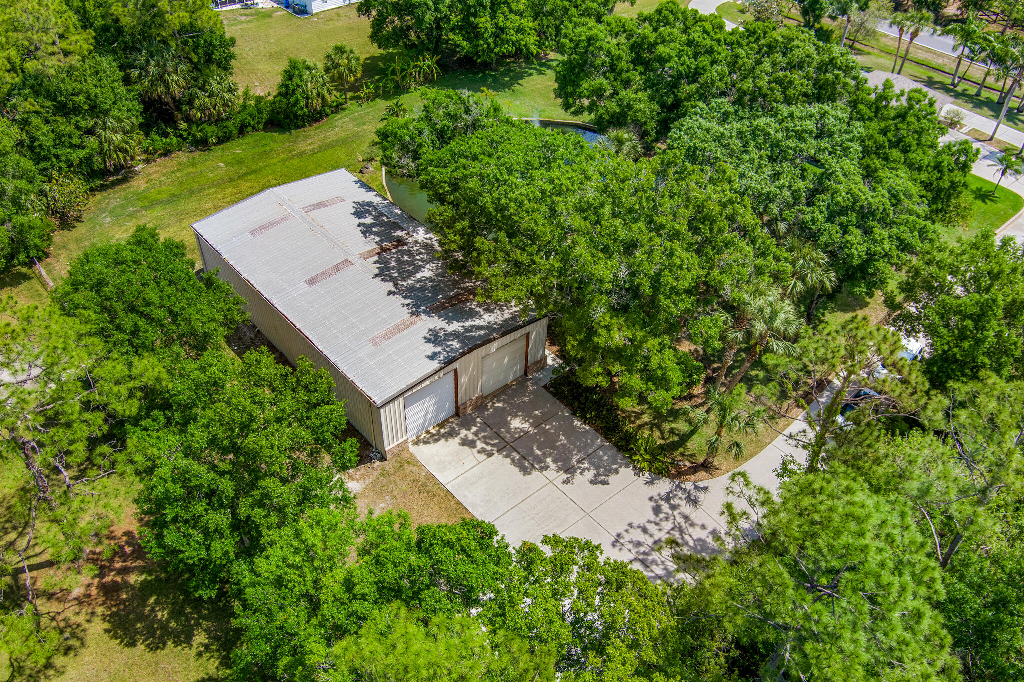 3240 Weber Road Malabar, FL 32950 - Photo 38 of 47 an aerial view of a house with a yard