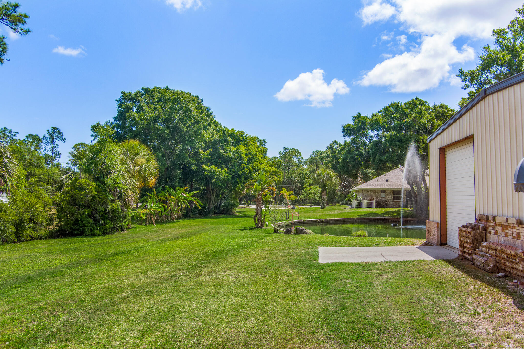 3240 Weber Road Malabar, FL 32950 - Photo 40 of 47 a view of a golf course with a big yard
