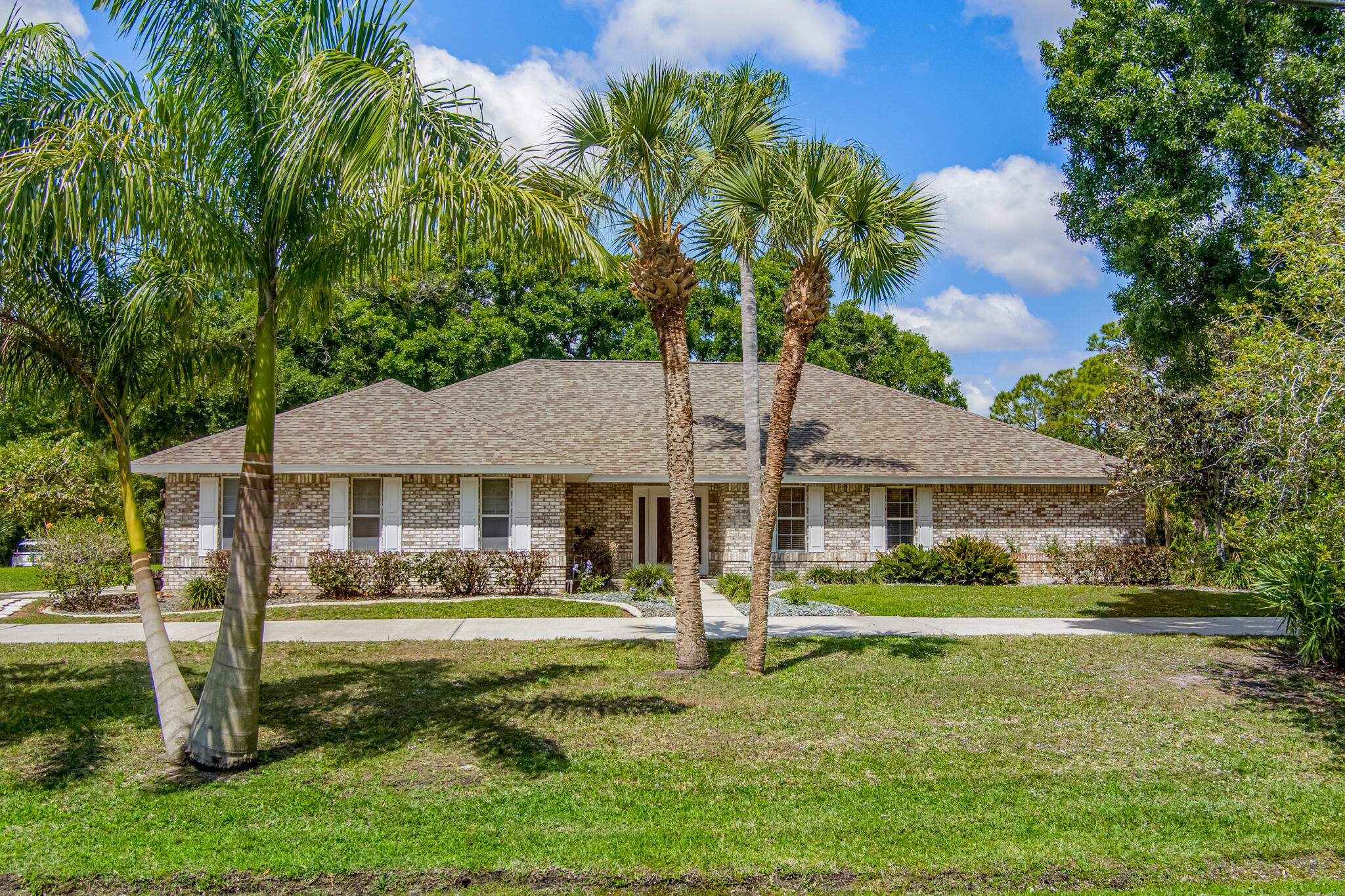 3240 Weber Road Malabar, FL 32950 - Photo 4 of 47 a front view of a house with a yard