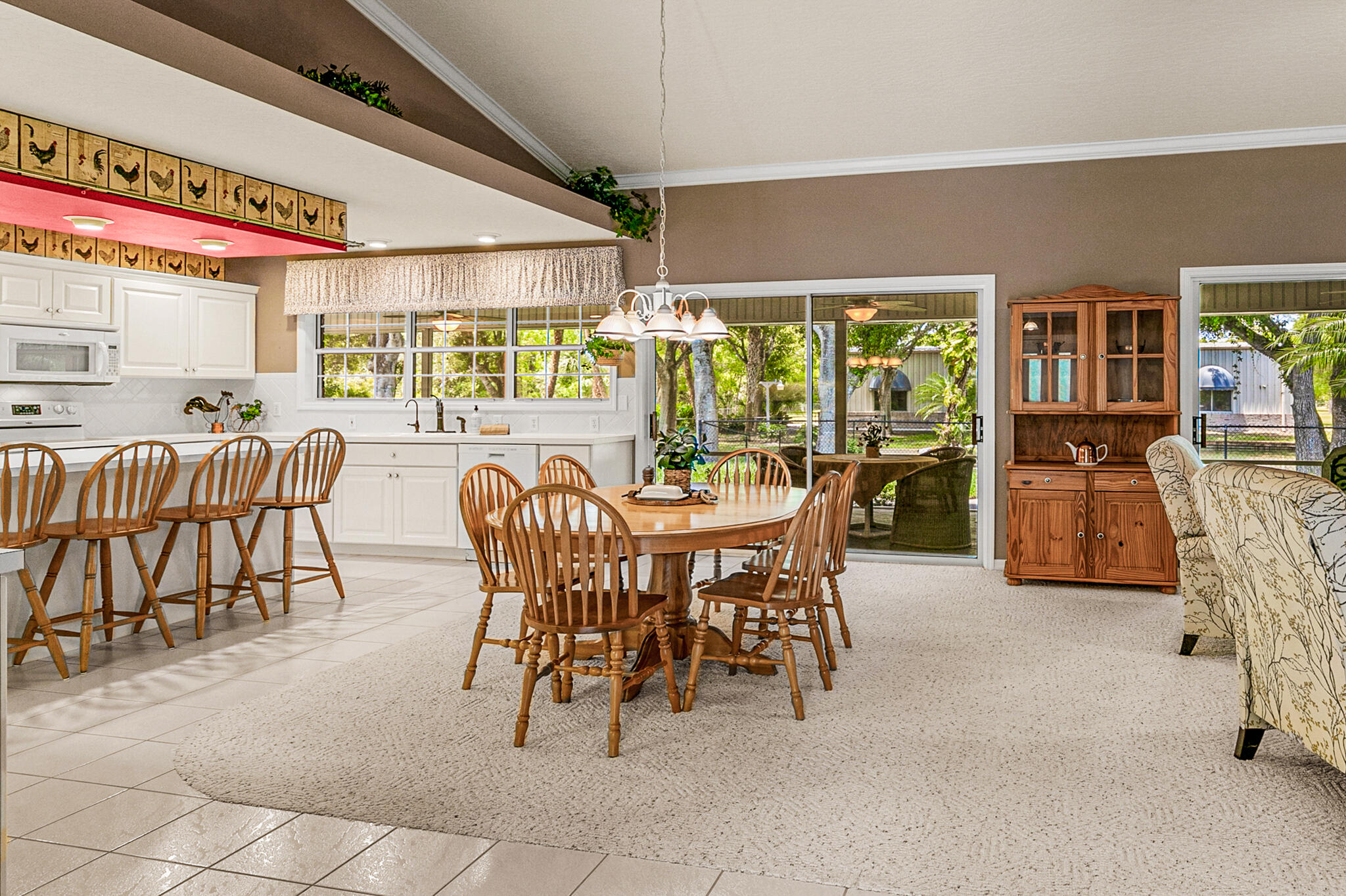 3240 Weber Road Malabar, FL 32950 - Photo 10 of 47 a dining room with furniture and large windows