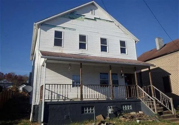 a view of a house with large windows