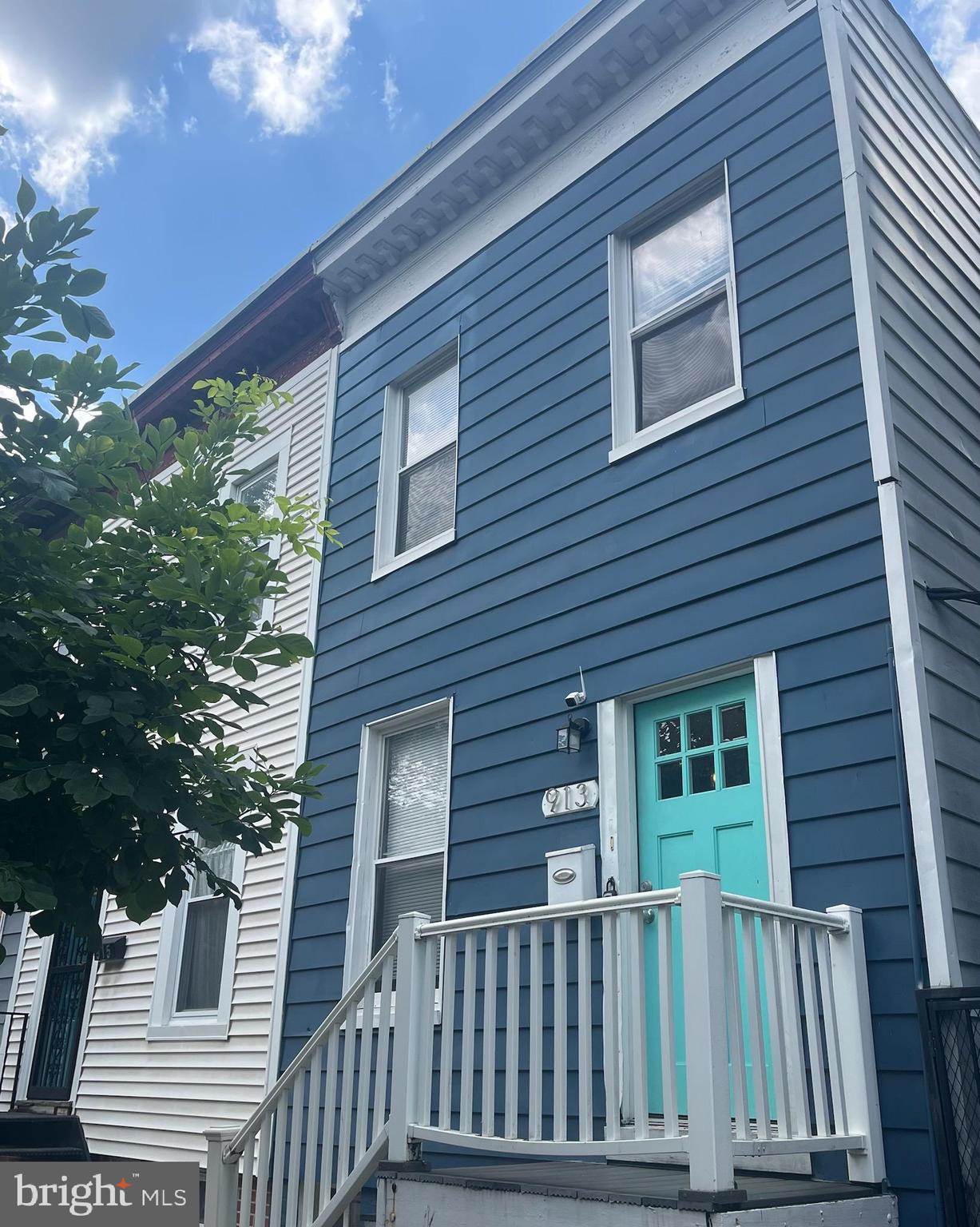 a front view of a house with a porch