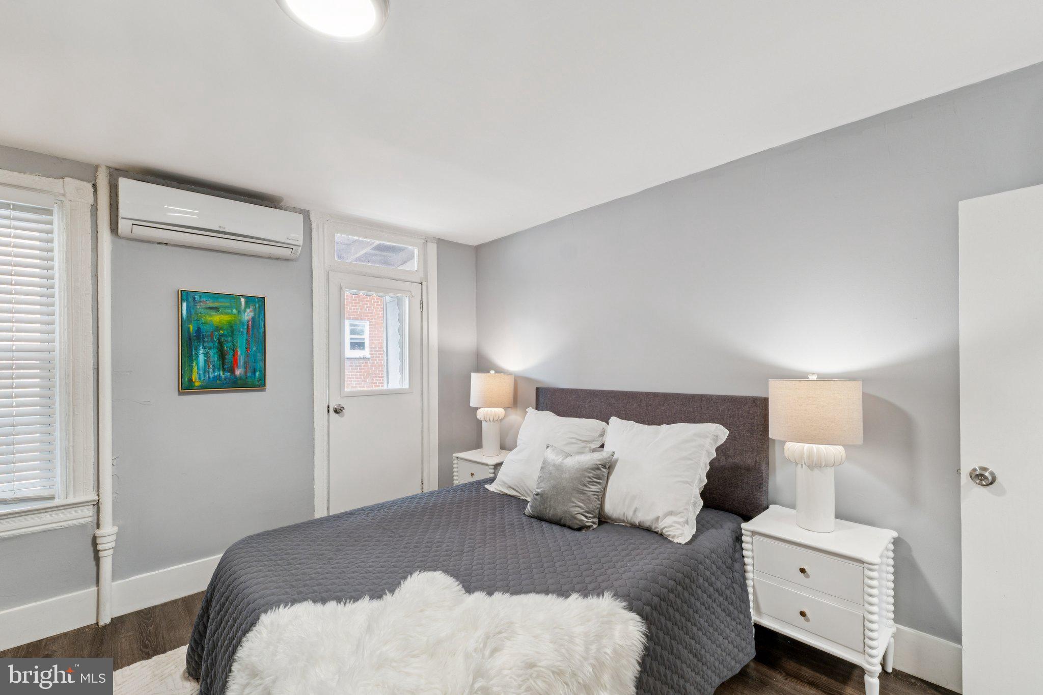 913 Columbia Road Northwest Washington, DC 20001 - Photo 12 of 37 a bedroom with a bed and a window