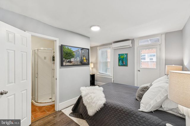 a bedroom with furniture and a window
