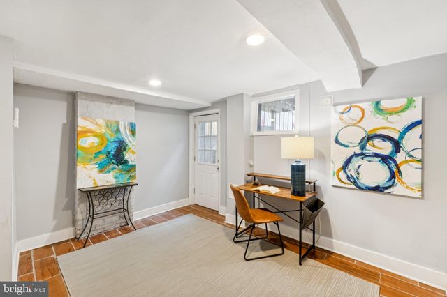 a workspace with furniture and window