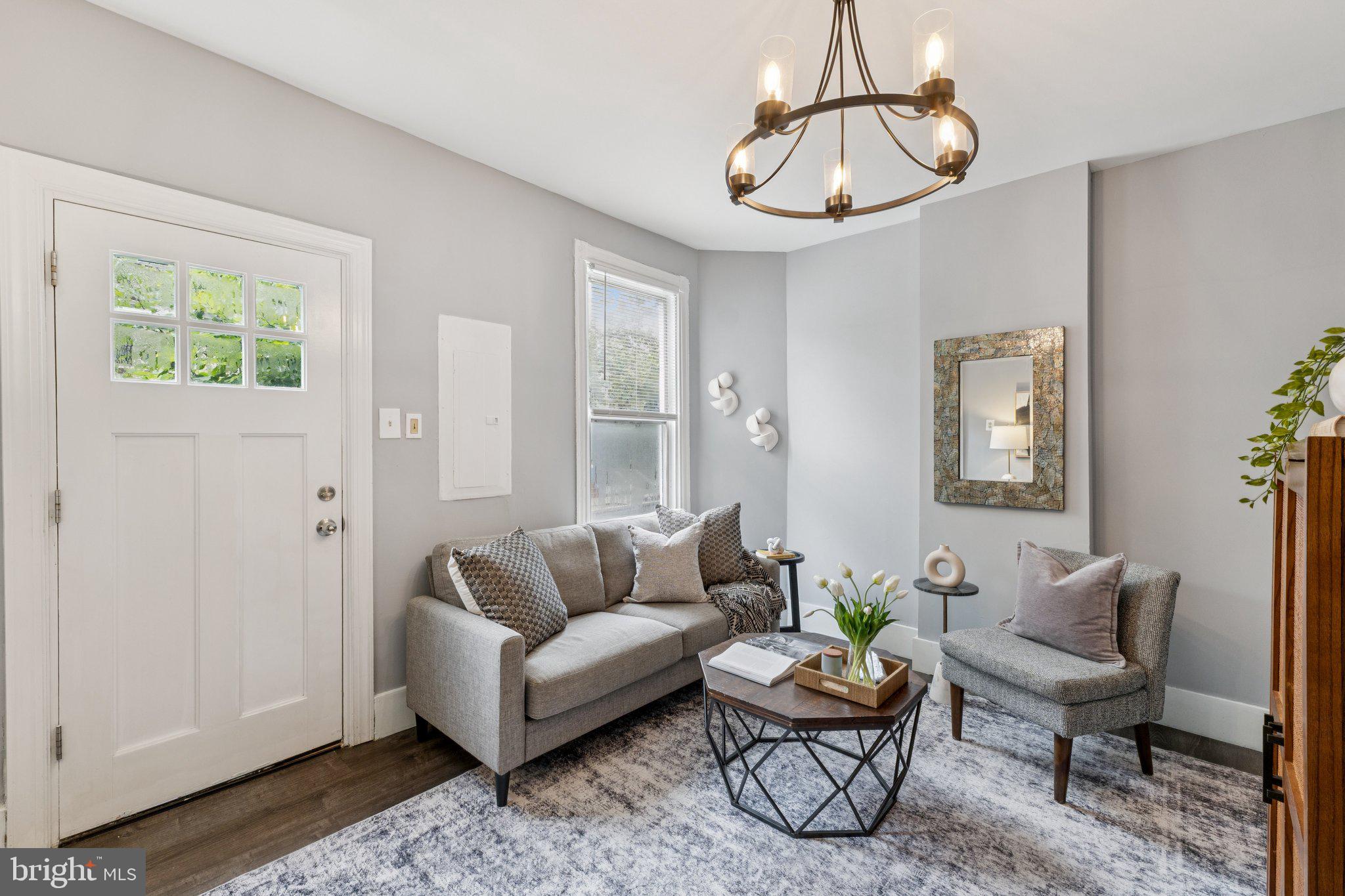 913 Columbia Road Northwest Washington, DC 20001 - Photo 3 of 37 a living room with furniture a rug and a window
