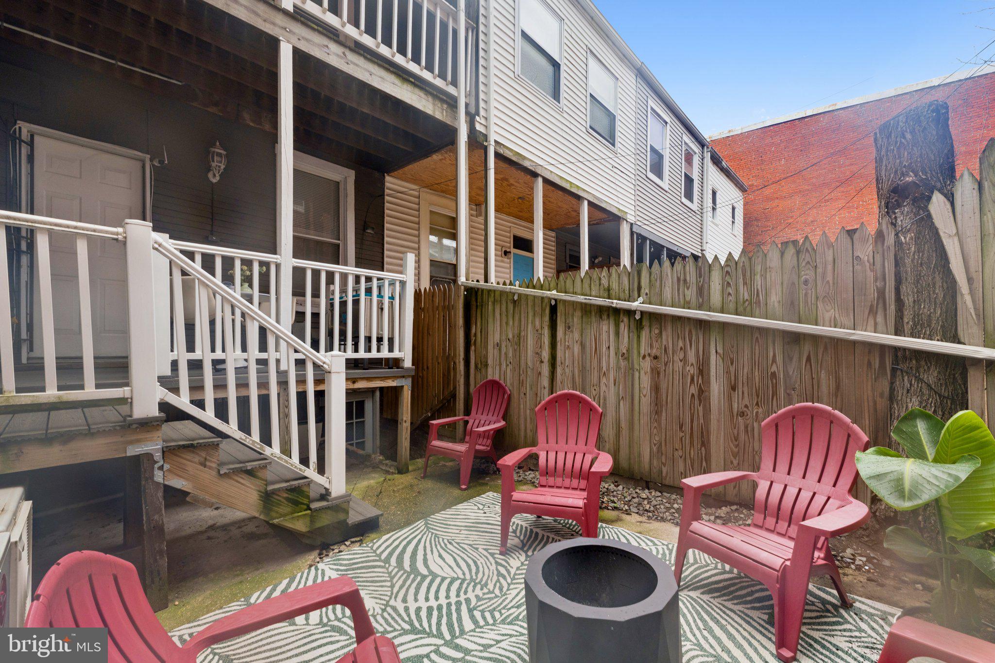 913 Columbia Road Northwest Washington, DC 20001 - Photo 33 of 37 a backyard of a house with outdoor seating