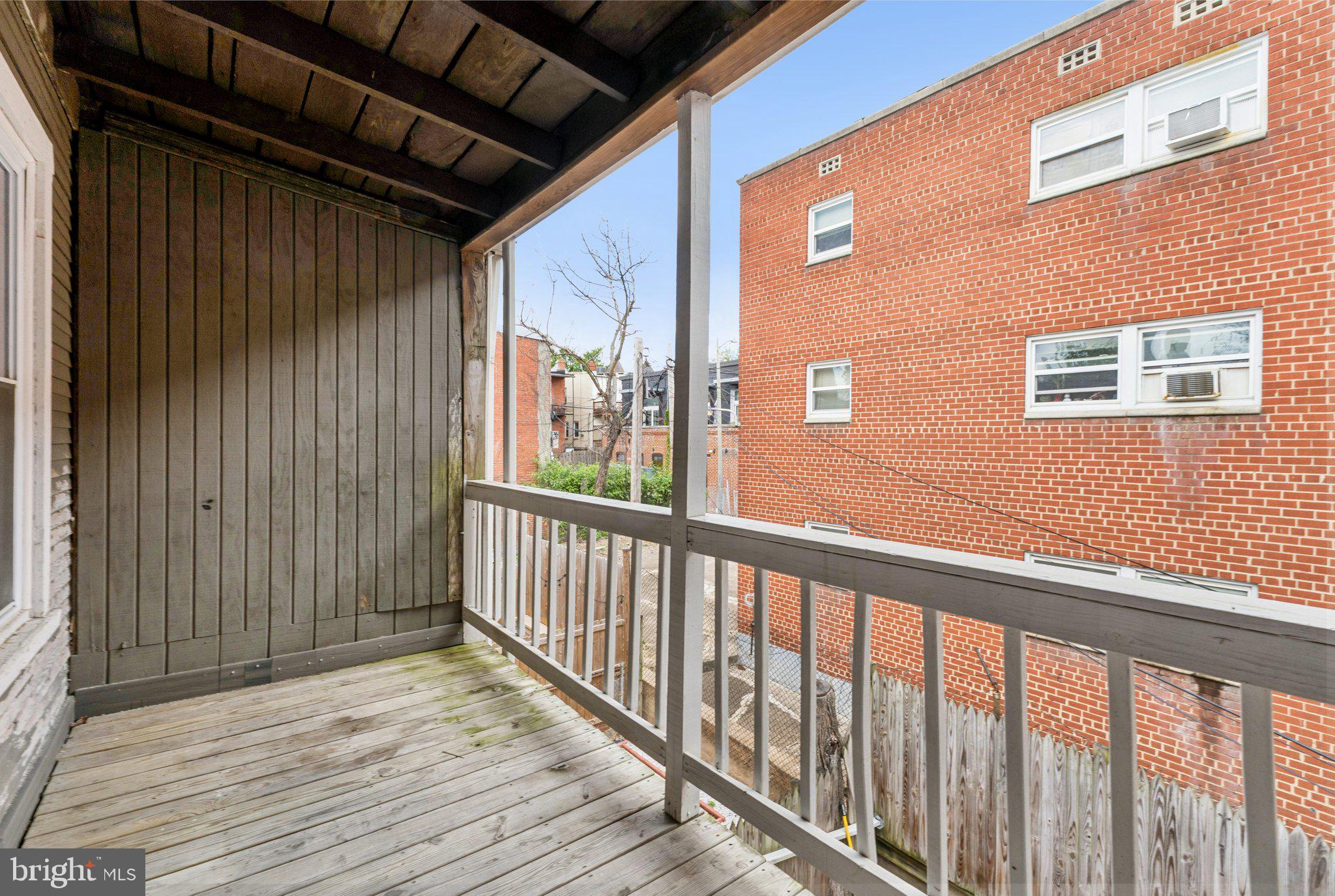 913 Columbia Road Northwest Washington, DC 20001 - Photo 34 of 37 a view of a balcony with wooden floor