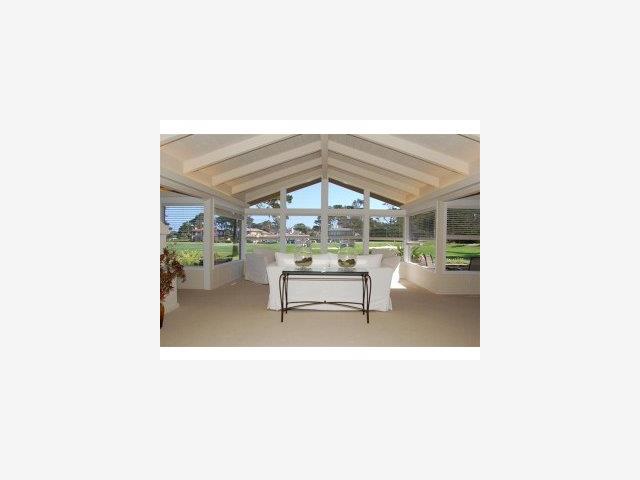 2964 Cormorant Road Pebble Beach, CA 93953 - Photo 5 of 8 a living room with a table and chairs