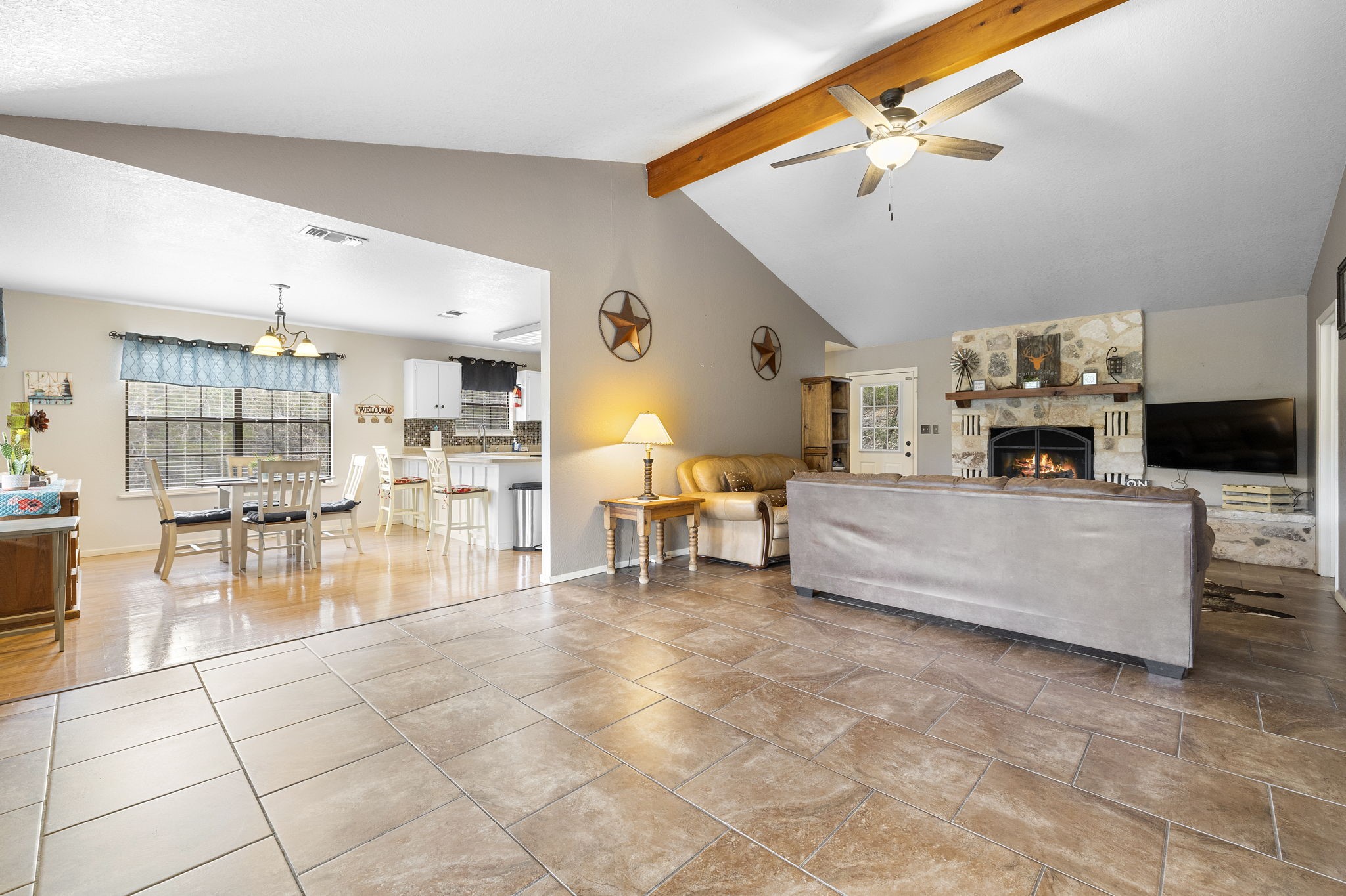 117 Cedar Rdg Lane Concan, TX 78838 - Photo 13 of 38 a living room with furniture and a flat screen tv