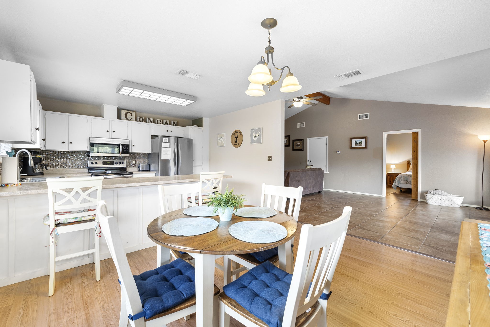 117 Cedar Rdg Lane Concan, TX 78838 - Photo 19 of 38 a view of a dining room with furniture and wooden floor