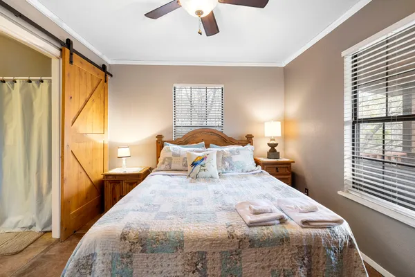 a bedroom with a bed and window