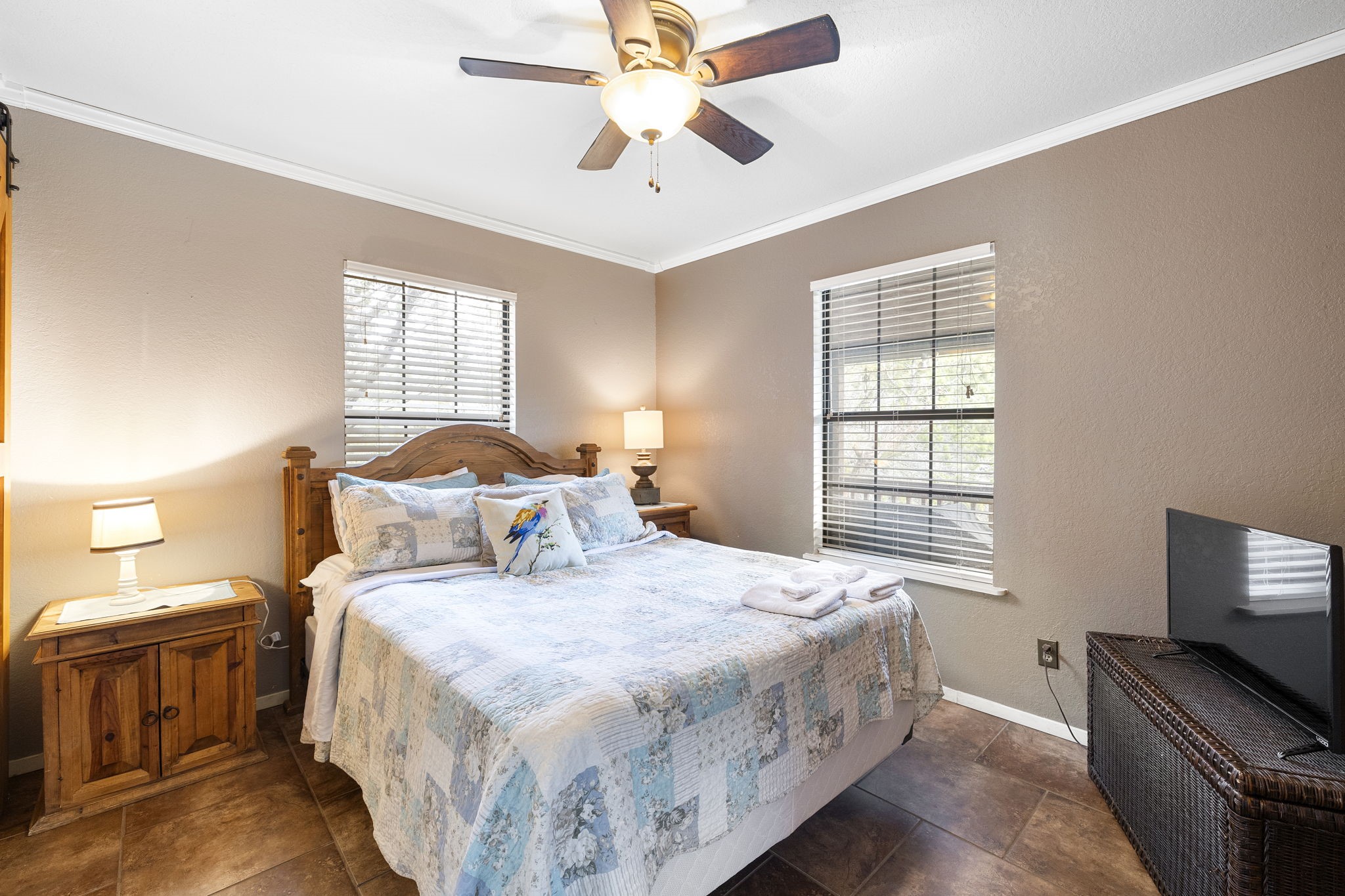 117 Cedar Rdg Lane Concan, TX 78838 - Photo 23 of 38 a bedroom with a bed and a flat screen tv