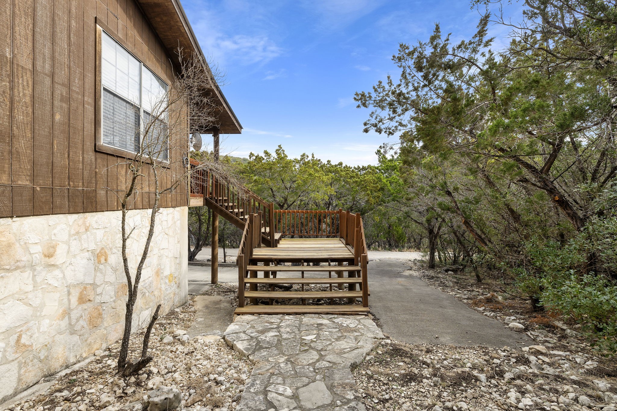 117 Cedar Rdg Lane Concan, TX 78838 - Photo 24 of 38 a view of a chairs setting on the deck