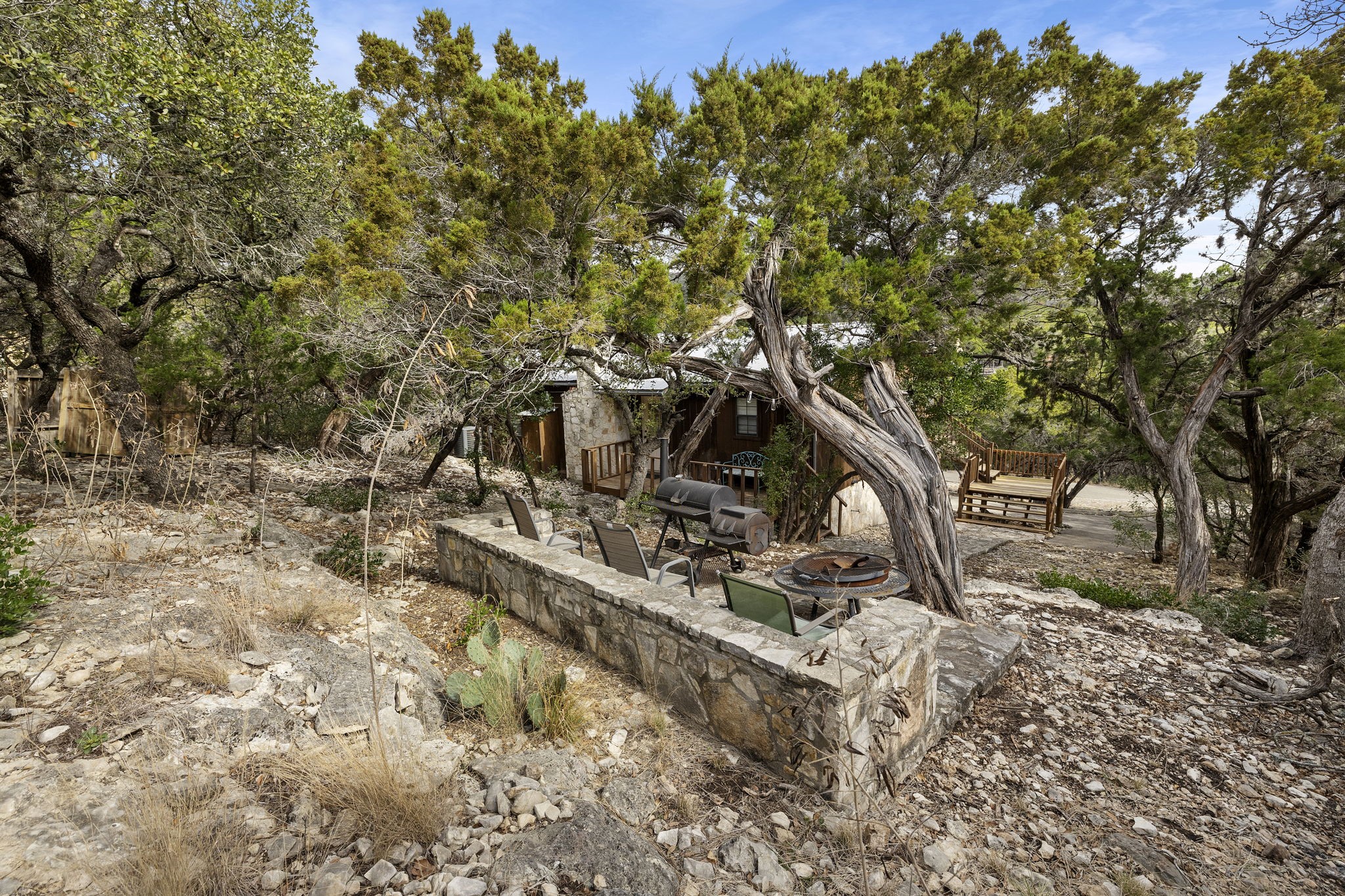 117 Cedar Rdg Lane Concan, TX 78838 - Photo 25 of 38 a backyard of a house with lots of green space
