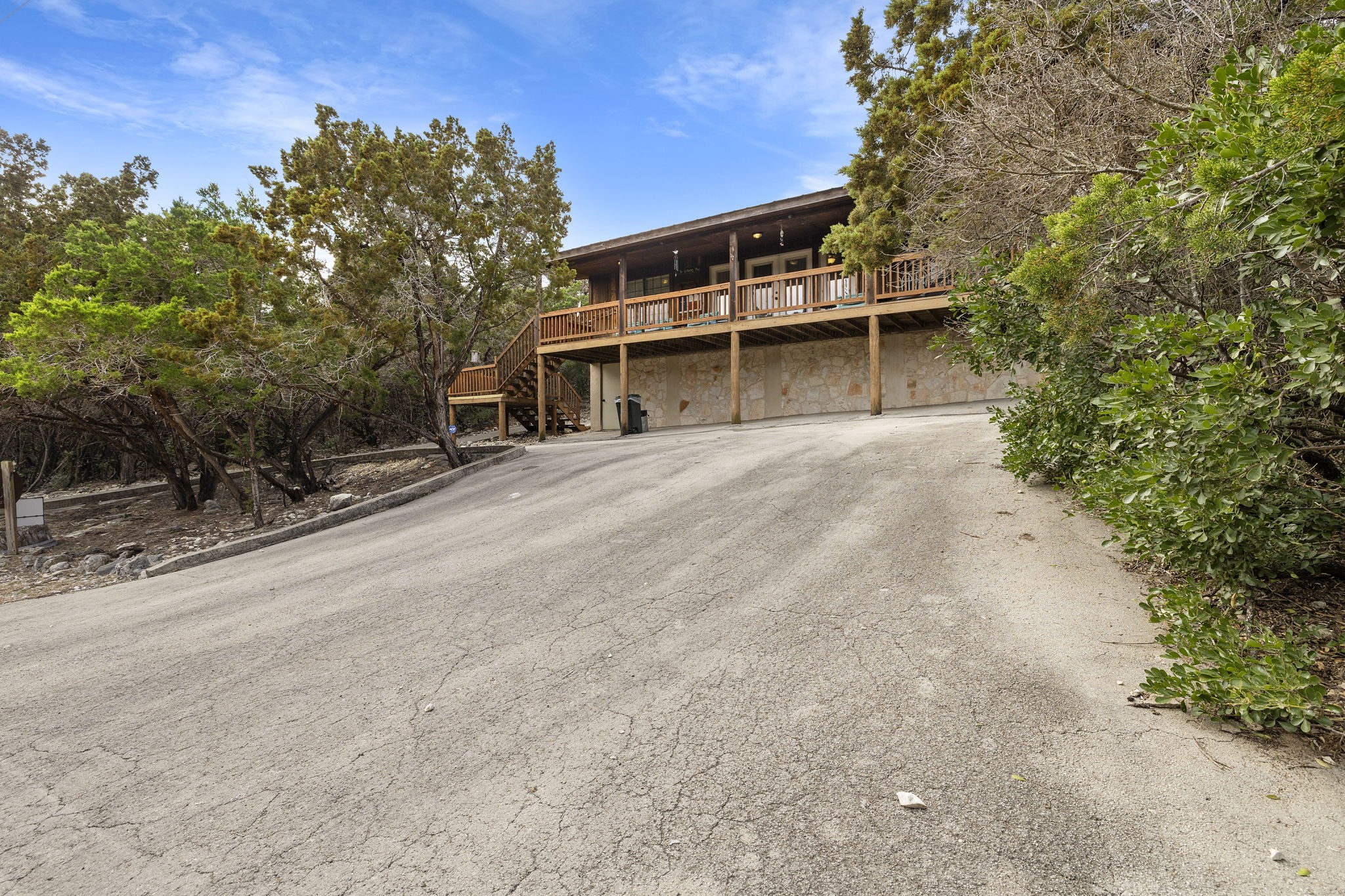 117 Cedar Rdg Lane Concan, TX 78838 - Photo 26 of 38 a front view of a house with a yard