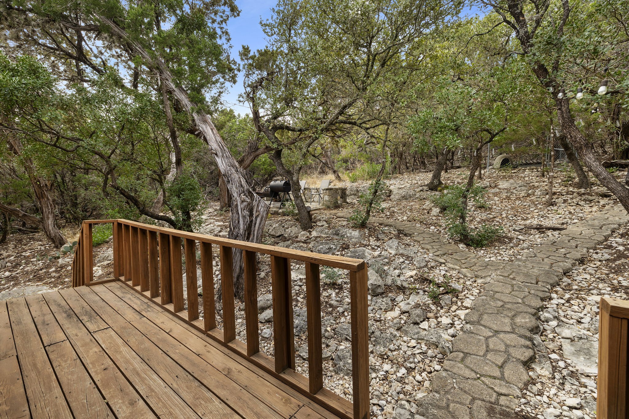 117 Cedar Rdg Lane Concan, TX 78838 - Photo 30 of 38 a balcony with wooden floor and trees