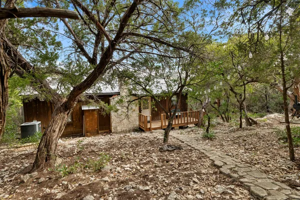 a backyard of a house with lots of trees