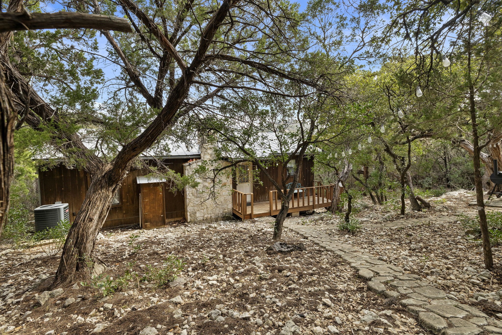 117 Cedar Rdg Lane Concan, TX 78838 - Photo 33 of 38 a backyard of a house with lots of trees