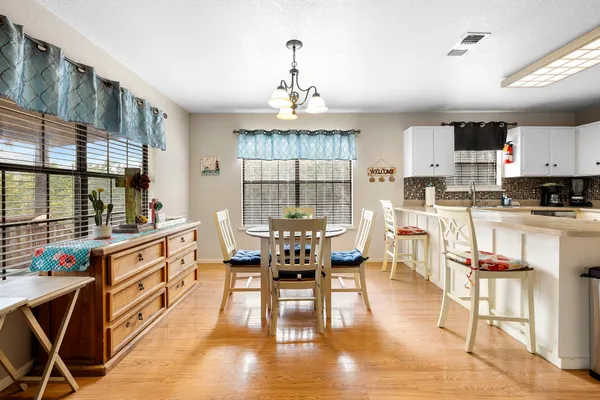 a view of a dining room with furniture window and outside view