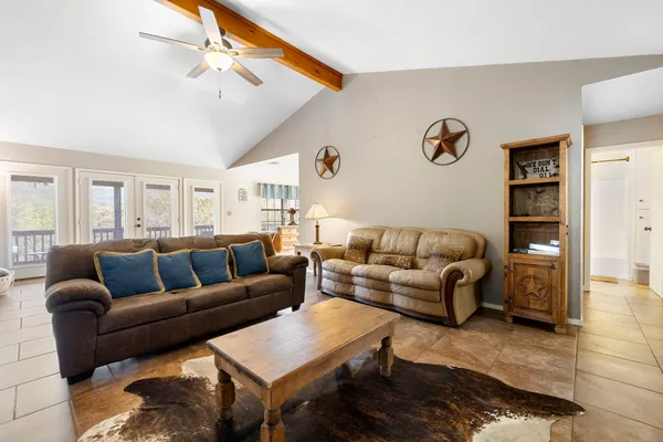 a living room with furniture and a rug