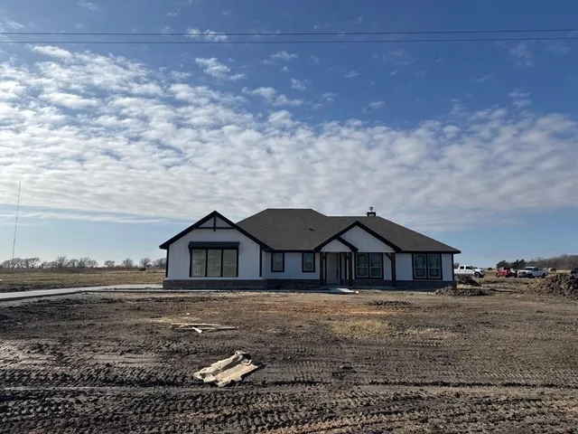 an empty room with mirror in a kitchen