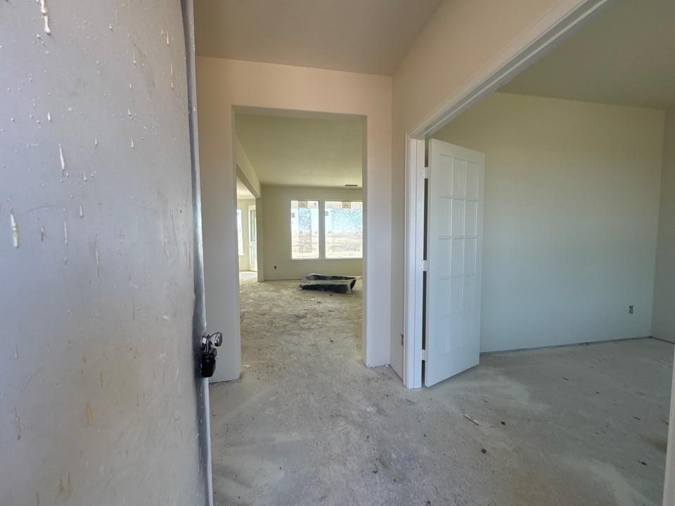 8885 County Road 623 Blue Ridge, TX 75424 - Photo 2 of 11 an empty room with mirror in a kitchen