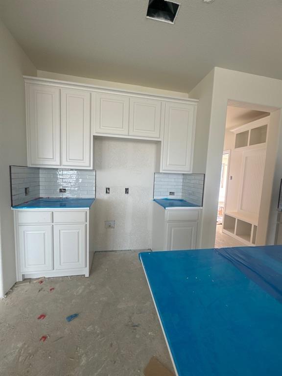 8885 County Road 623 Blue Ridge, TX 75424 - Photo 4 of 11 a kitchen with kitchen island white cabinets and refrigerator