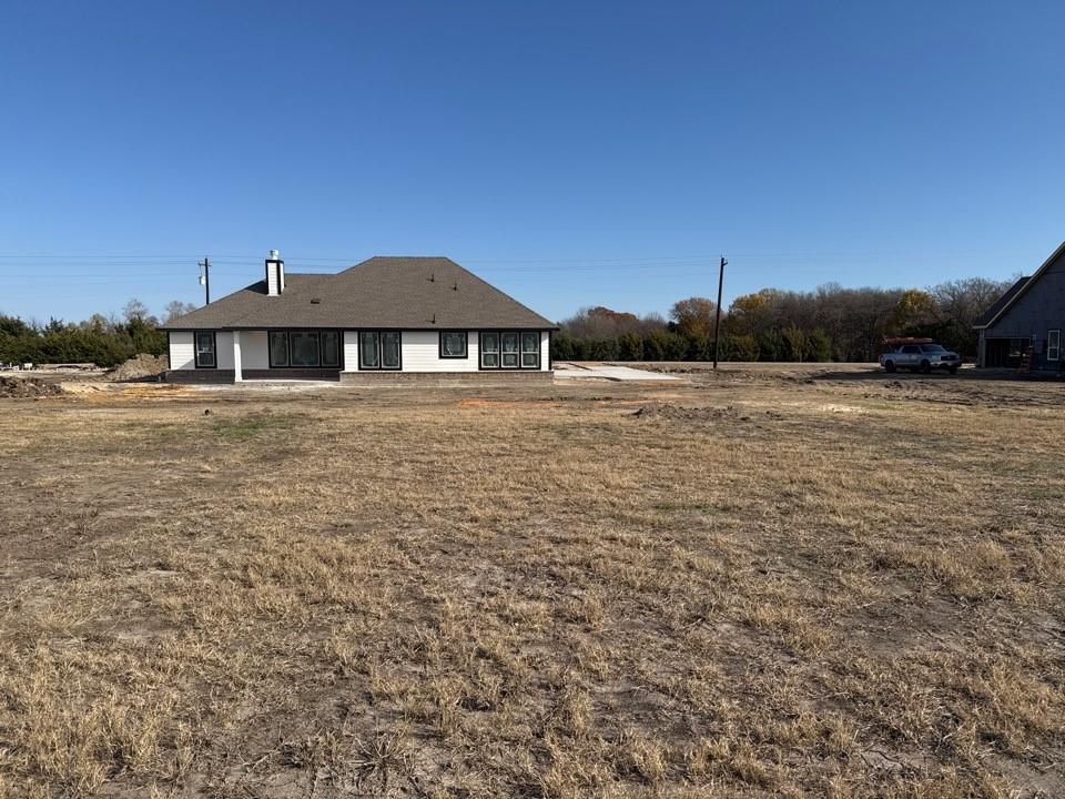 8885 County Road 623 Blue Ridge, TX 75424 - Photo 10 of 11 a front view of a house with a yard