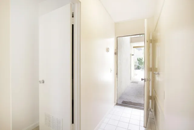 a view of a bathroom with a glass shower door