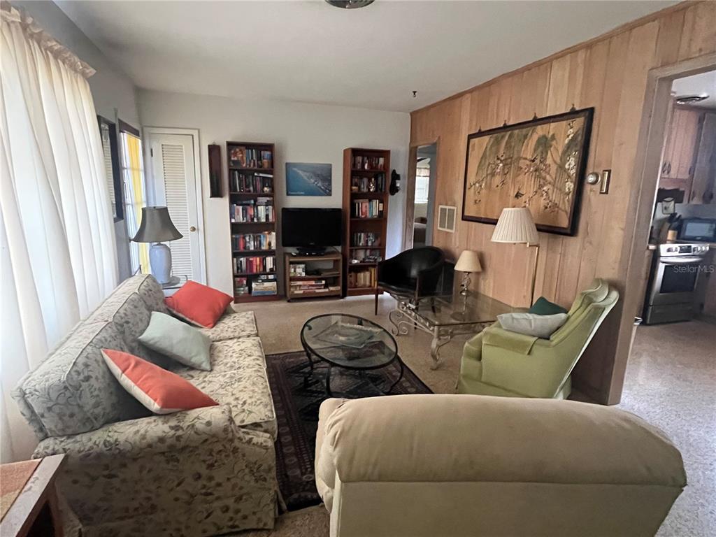 505 Granada Avenue Venice, FL 34285 - Photo 13 of 30 a living room with furniture and a flat screen tv