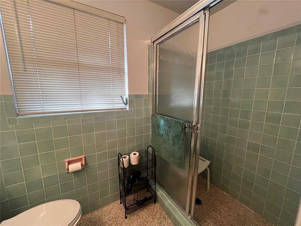 505 Granada Avenue Venice, FL 34285 - Photo 19 of 30 a bathroom with a toilet and a shower