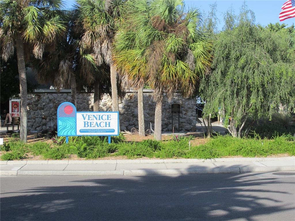 505 Granada Avenue Venice, FL 34285 - Photo 23 of 30 a front view of multi story residential apartment building with yard and sign board