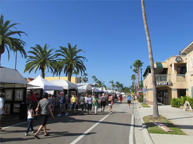 a front view of house with yard and trees around