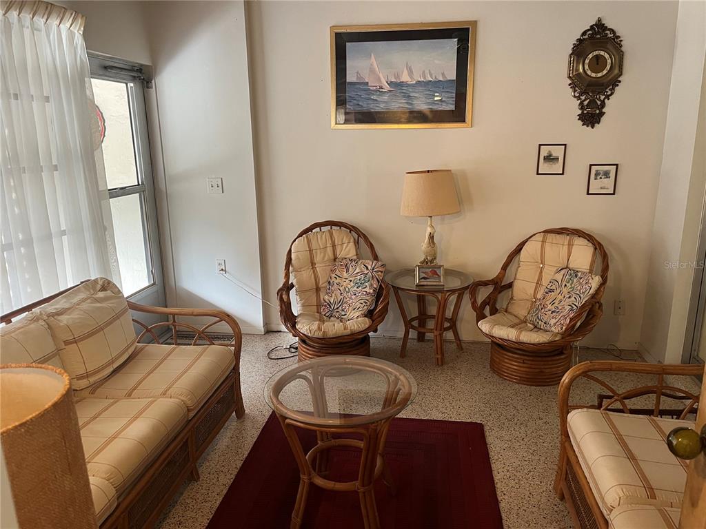 505 Granada Avenue Venice, FL 34285 - Photo 9 of 30 a living room with furniture a couch and a window
