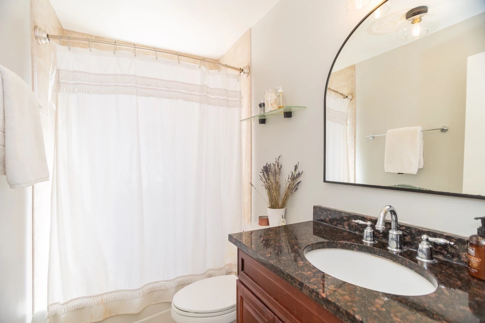 2026 North Burling Street, Unit 208 Chicago, IL 60614 - Photo 11 of 14 a bathroom with a granite countertop sink toilet and shower