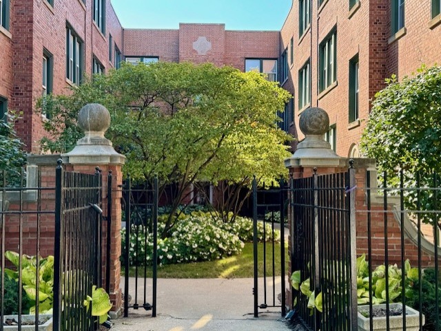 2026 North Burling Street, Unit 208 Chicago, IL 60614 - Photo 14 of 14 a view of building along with potted plants and a building