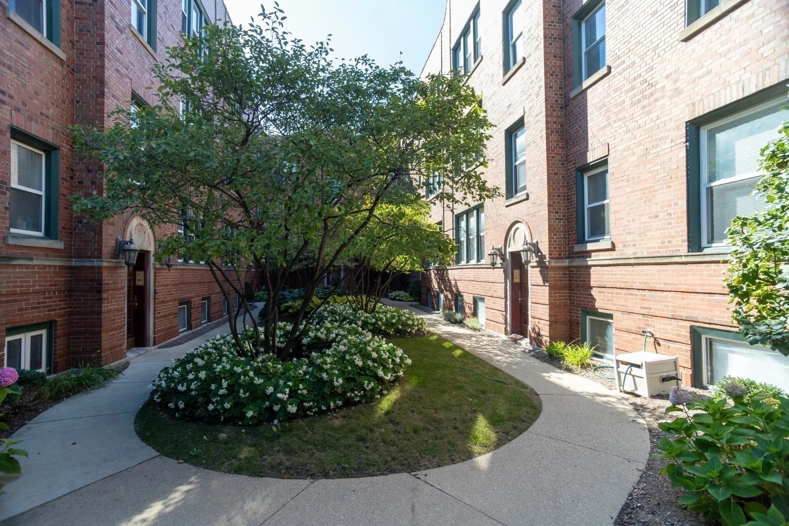 2026 North Burling Street, Unit 208 Chicago, IL 60614 - Photo 2 of 14 a view of a garden with pathway